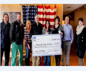 Presenting the check from left to right: Ryan Grassley, David Cook, Karen Tuckett, Joe Carter, Angie Reece, Barbara Bassett (American Cancer Society), David Hiestand, and Cidne Christensen (American Cancer Society)  Davy Crockett is not pictured, but he d
